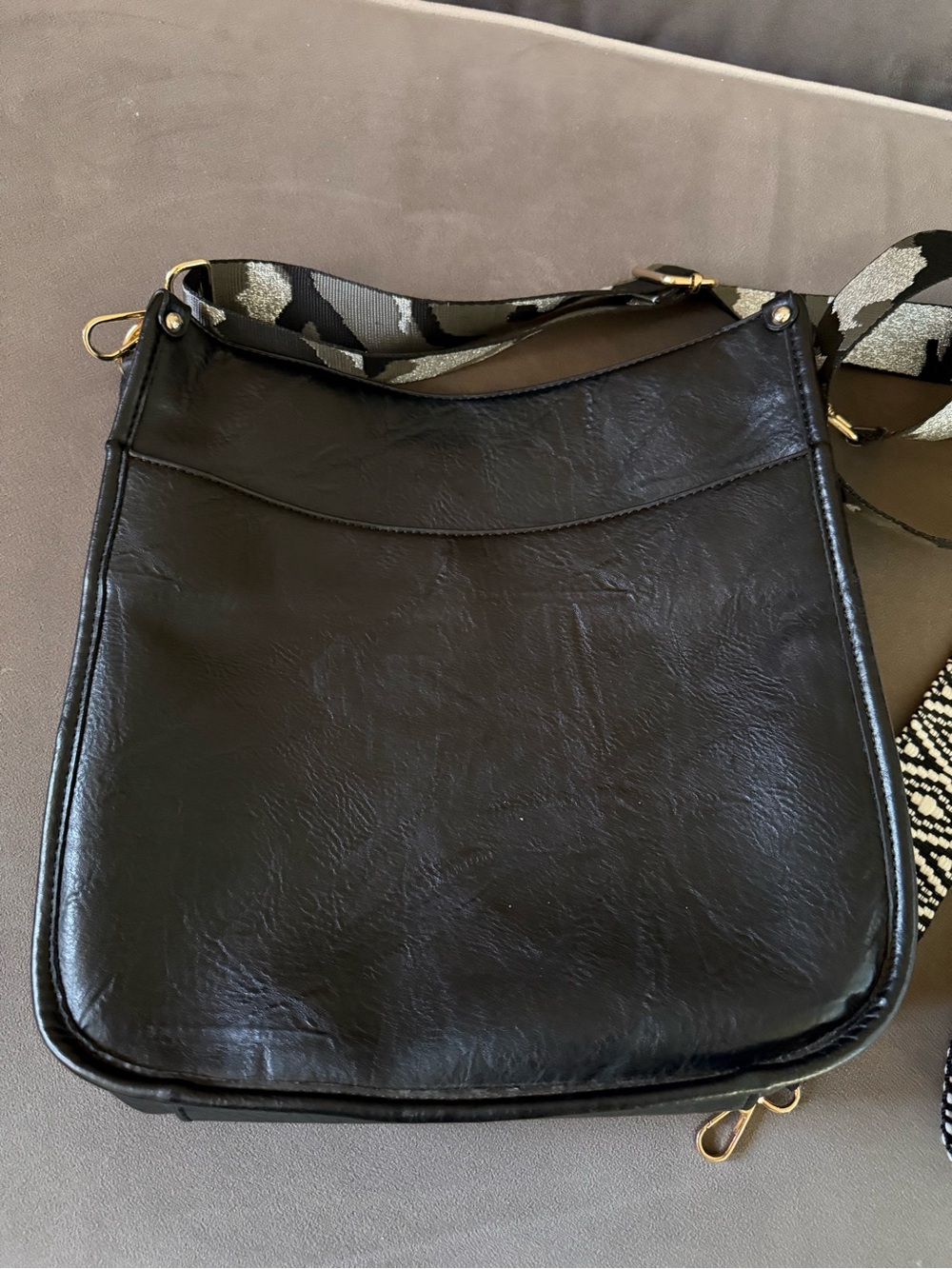 Black Leather Crossbody Bag with Patterned Strap